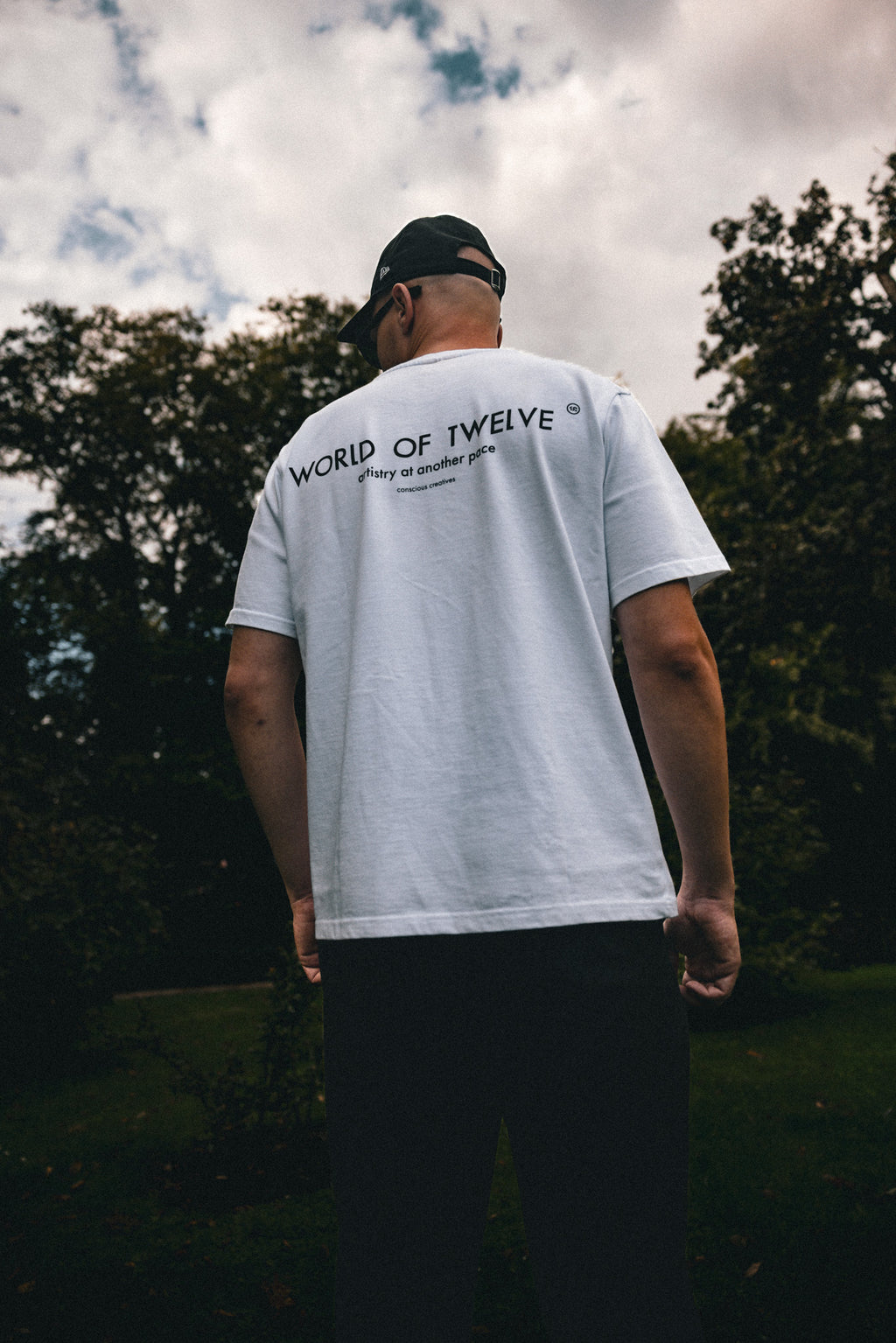 Man wearing the Essential oversized tee in white, back view