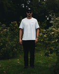 Man wearing the Essential oversized tee in white, front view
